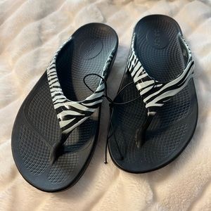Animal print Oofos flip flops, size 7